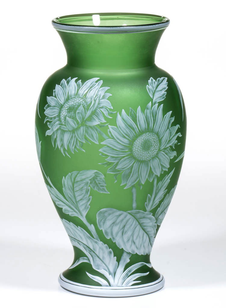 THOMAS WEBB CAMEO GLASS VASE: THOMAS WEBB CAMEO GLASS VASE, white to green, urn form with a tapered mouth, Sunflower motif, matching band decoration to the base and mouth, foliate reverse, polished pontil mark and base, signed "TH