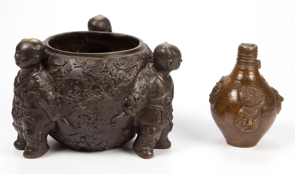 CHINESE BRONZE FIGURAL CENSER / PLANTER: CHINESE BRONZE FIGURAL CENSER / PLANTER, in the form of three boys holding a large bowl or vase, with floral and foliate relief to bowl and to boys' clothes. Unmarked. Together with an earthenware jug