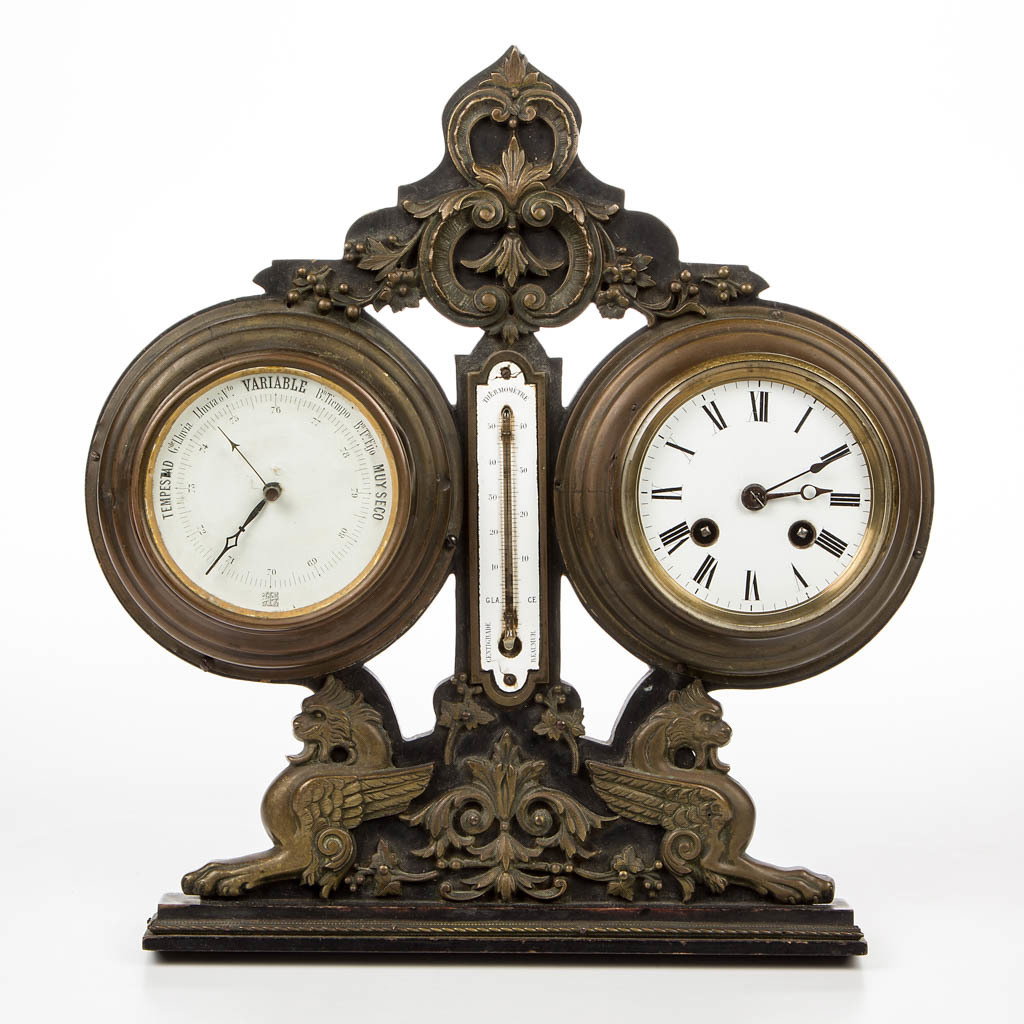 FRENCH EBONIZED WOOD AND BRASS CLOCK, BAROMETER, AND: FRENCH EBONIZED WOOD AND BRASS CLOCK, BAROMETER, AND THERMOMETER, easel style with applied sphinx and scroll decorations, clock with enamel dial, barometer with paper dial. Late 19th/early 20th centur