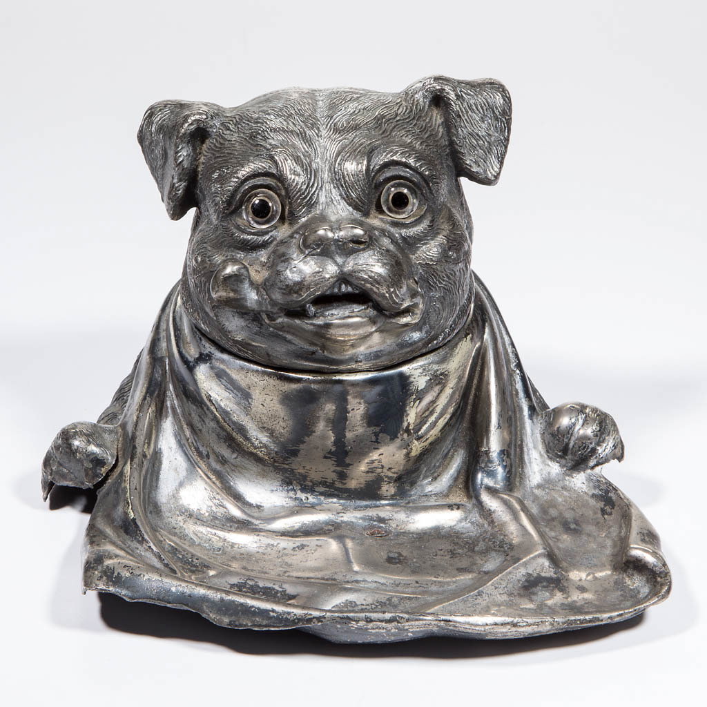 JENNINGS BROTHERS MANUFACTURING CO. (BRIDGEPORT, CT): JENNINGS BROTHERS MANUFACTURING CO. (BRIDGEPORT, CT) FIGURAL SILVER-PLATED INKSTAND, modeled as a stylized bulldog holding an outstretched bib tied around its neck, glass eyes, marked "J. B. 683" to u