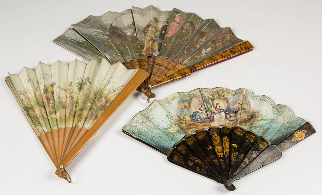 LADY'S DECORATIVE FOLDING HAND FANS, LOT OF THREE: LADY'S DECORATIVE FOLDING HAND FANS, LOT OF THREE, with printed, hand-drawn, and colored depictions of romantic interludes, two on silk and one on paper. Second half 19th/early 20th century. 10" to 13
