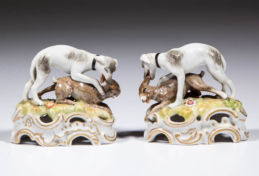 GERMAN LUDWIGSBURG HUNTING PORCELAIN FIGURES, LOT OF: GERMAN LUDWIGSBURG HUNTING PORCELAIN FIGURES, LOT OF TWO, each having a dog figure biting the ears of a rabbit/hare, painted in polychrome enamels with pierced base. Marked on the base of each with tw