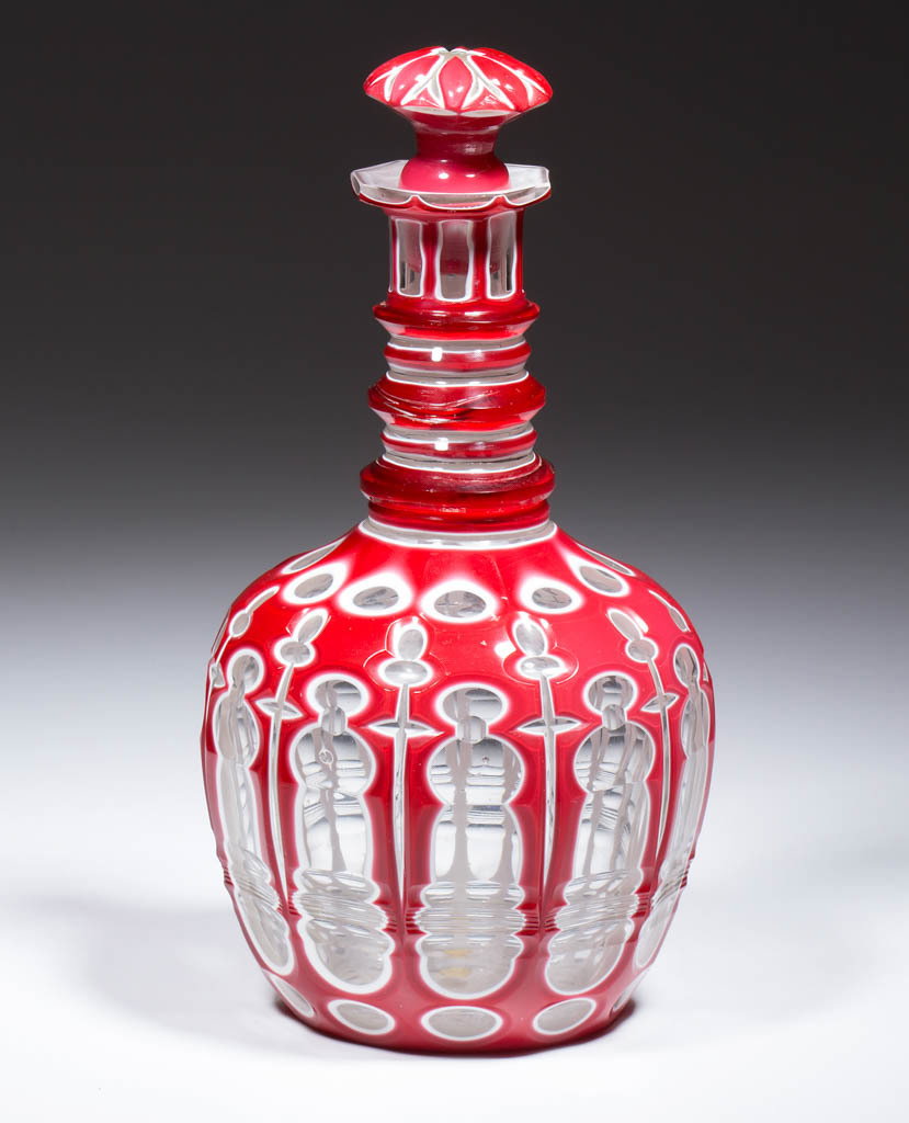 EUROPEAN CUT DOUBLE OVERLAY DECANTER: EUROPEAN CUT DOUBLE OVERLAY DECANTER, deep rose to opaque white to colorless, bulbous form with a highly complex design consisting of long irregular windows with additional horizontal cuttings, separa