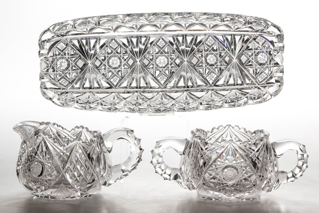 AMERICAN BRILLIANT CUT GLASS TABLE ARTICLES, LOT OF: AMERICAN BRILLIANT CUT GLASS TABLE ARTICLES, LOT OF THREE, colorless, comprising a signed Hawkes celery tray and a signed Libbey creamer and sugar. Late 19th/early 20th century. Tray 10 3/4" L. Undama
