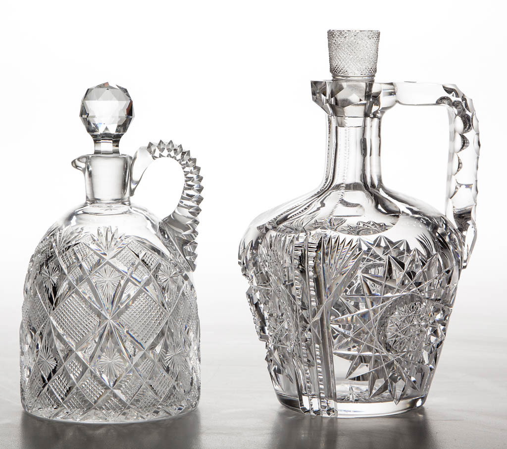 AMERICAN BRILLIANT CUT GLASS DECANTERS, LOT OF TWO: AMERICAN BRILLIANT CUT GLASS DECANTERS, LOT OF TWO, colorless, comprising a signed Fry "Japan" whiskey, and a Straus "Venetian" bell-shape, each with applied handle and period stopper. Late 19th/early
