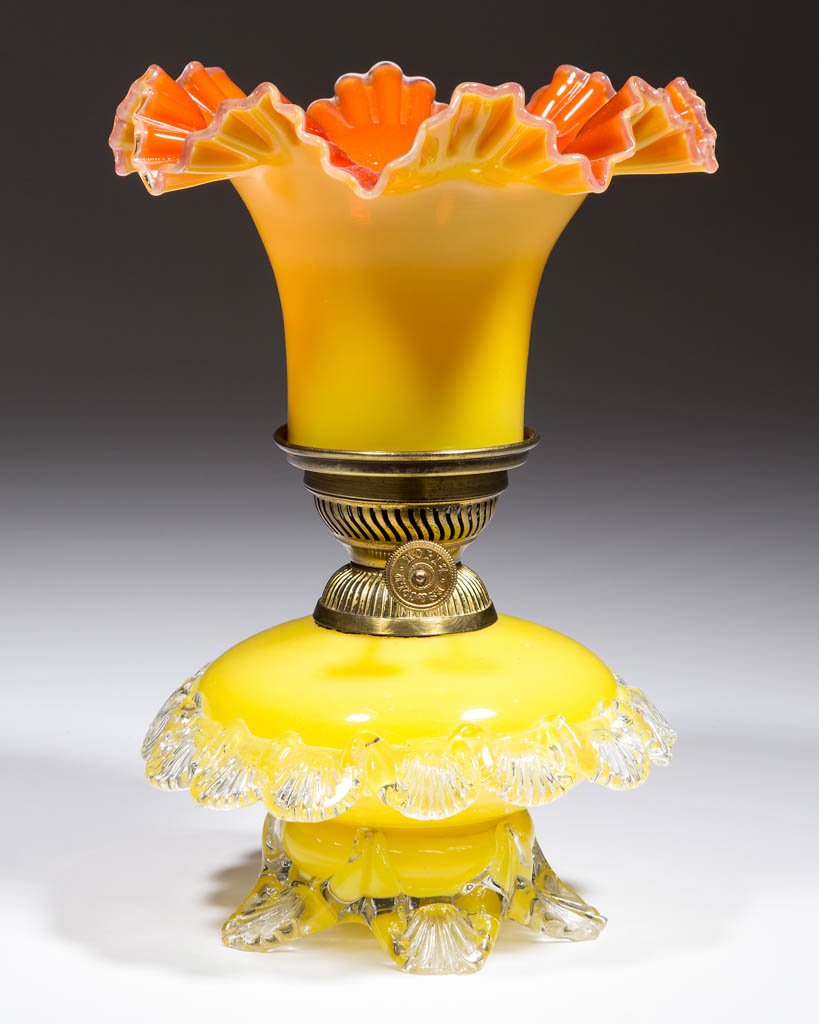 ART GLASS WITH RIGAREE MINIATURE LAMP: ART GLASS WITH RIGAREE MINIATURE LAMP, opaque lemon yellow compressed globular-form font, applied colorless rigaree band to medial of body with ribbed scallops, applied colorless base with five ribbed