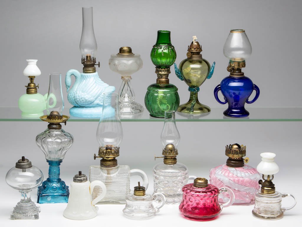 ASSORTED PATTERN MINIATURE LAMPS, LOT OF 15: ASSORTED PATTERN MINIATURE LAMPS, LOT OF 15, including a whale oil colorless free-blown globular-form example with a stepped foot and a alabaster/clambroth panelled ovals example; a colorless small si