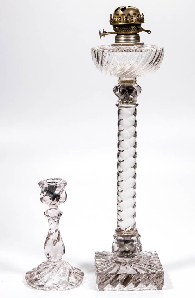 FOSTORIA NO. 1 CASCADE RIB KEROSENE BANQUET LAMP: FOSTORIA NO. 1 CASCADE RIB KEROSENE BANQUET LAMP, colorless, five-part construction comprising an urn-form swirling font, stem, square foot, and two swirled glass sleeves over nickel-plate connectors,
