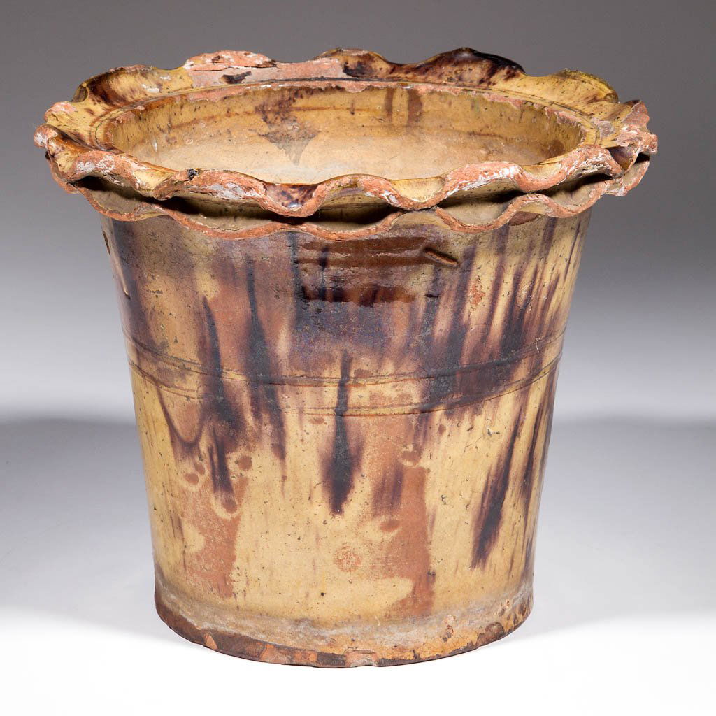 SHENANDOAH VALLEY OF VIRGINIA DECORATED EARTHENWARE /: SHENANDOAH VALLEY OF VIRGINIA DECORATED EARTHENWARE / REDWARE FLOWER POT, lead- and manganese-glaze over a slip wash, slightly conical form with two incised medial rings, and fluted and crimped rim, d