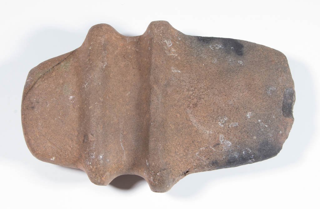NATIVE AMERICAN STONE AXE: NATIVE AMERICAN STONE AXE, very large example, hardstone, full groove, hammer poll, southeastern "barbed" type, with high ridges to each side of the groove extending above and below the blade. Late Ar
