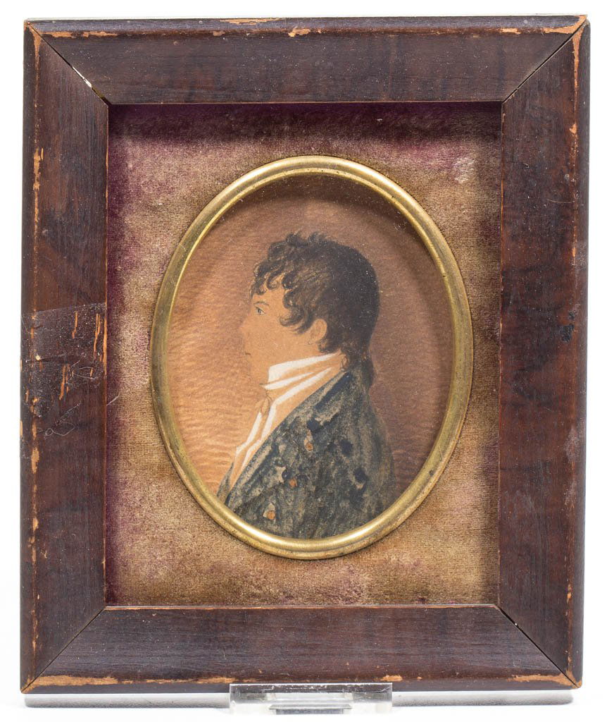 AMERICAN OR BRITISH SCHOOL (19TH CENTURY) FOLK ART: AMERICAN OR BRITISH SCHOOL (19TH CENTURY) FOLK ART MINIATURE PORTRAIT OF A YOUNG MAN, watercolor, gauche, and pencil on paper, profile depiction of a young man wearing a dark blue jacket, signed "J Ni
