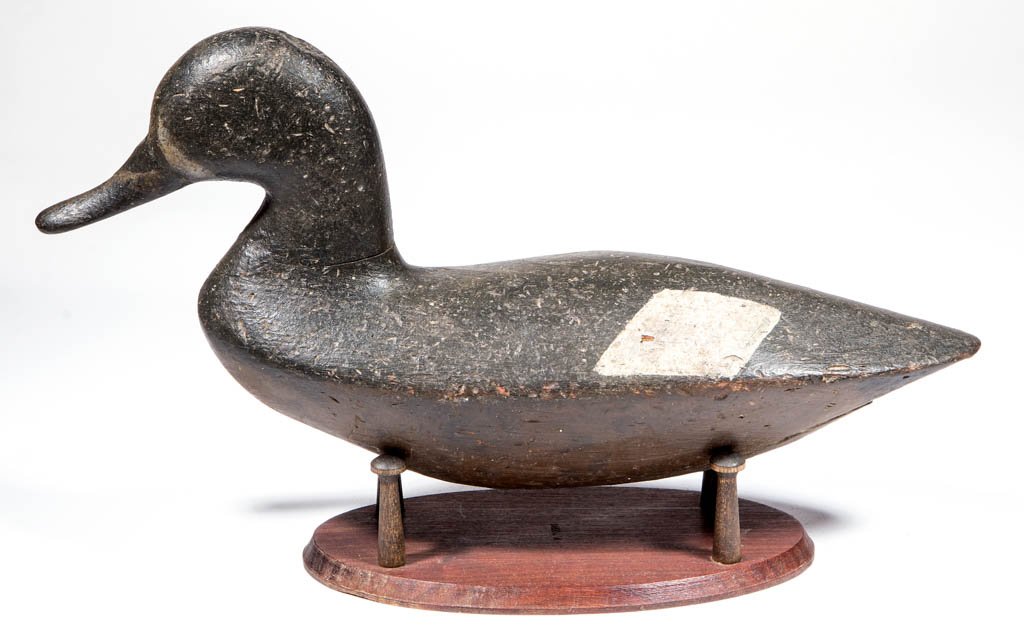 AMERICAN CARVED AND PAINTED DECOY: AMERICAN CARVED AND PAINTED DECOY, diminutive stylized form, retaining likely original working surface and lead weight attached to underside of base. Together with a custom modern stand for display. T
