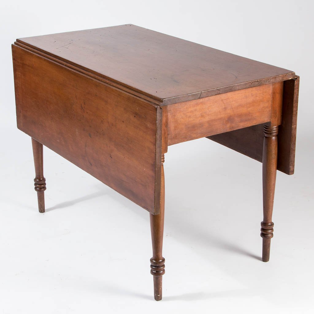 AMERICAN LATE FEDERAL CHERRY FALL-LEAF DINING TABLE: AMERICAN LATE FEDERAL CHERRY FALL-LEAF DINING TABLE, the rectangular top fitted with two hinged fall leaves over a single scratch-beaded drawer to one apron end, raised on tall ring-turned legs ending