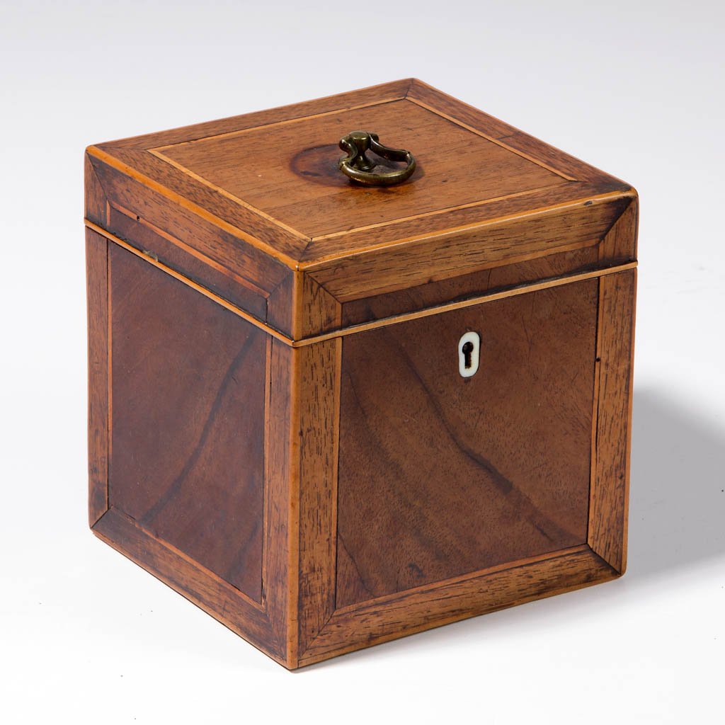 GEORGIAN INLAID MAHOGANY TEA CADDY: GEORGIAN INLAID MAHOGANY TEA CADDY, the hinged lid concealing a zinc-lined interior, line inlay and banded elements throughout, inlaid bone escutcheon. Retains an early surface with warm color. Circa 