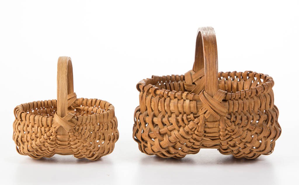 APPALACHIAN RIB-TYPE WOVEN-SPLINT MINIATURE BASKETS,: APPALACHIAN RIB-TYPE WOVEN-SPLINT MINIATURE BASKETS, LOT OF TWO, white oak, each kidney-form with wrapped rim, arched handle, and simple X-shape handle supports. Original dry natural surfaces. Mid 20t