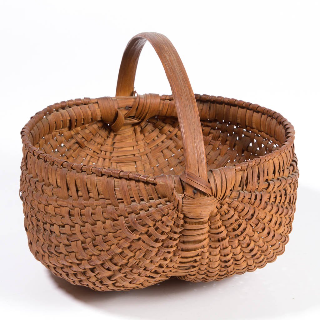 APPALACHIAN RIB-TYPE WOVEN-SPLINT BASKET: APPALACHIAN RIB-TYPE WOVEN-SPLINT BASKET, white oak, kidney form with converging ribs, low arched handle with wrapped attachment, wrapped double rim. Retains likely original dry natural surface. First