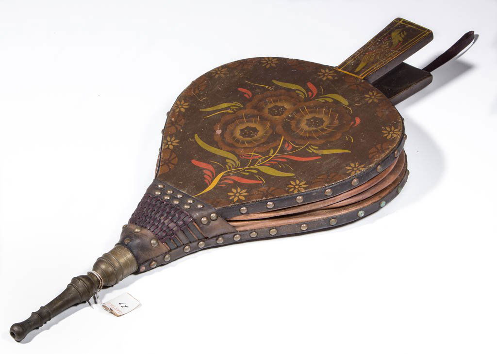 PAINT-DECORATED HEARTH BELLOWS: PAINT-DECORATED HEARTH BELLOWS, Spanish brown ground with hand-painted and stenciled polychrome flowers and rosettes, brass nozzle and leather trimmings. 19th century. 18 1/4" L.Excellent working cond