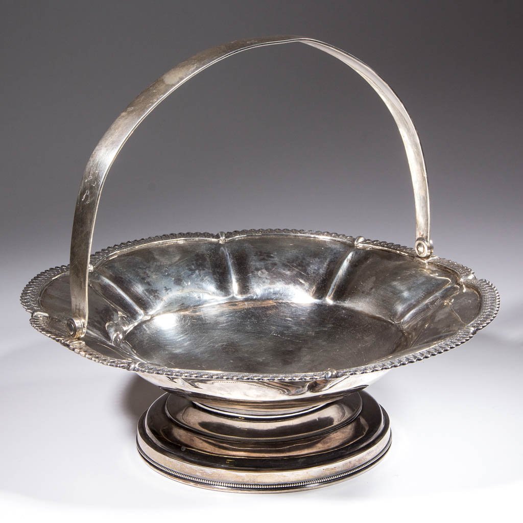 NEW ORLEANS, LOUISIANA COIN SILVER CAKE BASKET: NEW ORLEANS, LOUISIANA COIN SILVER CAKE BASKET, with applied molded rim, lobed shoulder, and swiveling handle, on squat circular foot, marked "WHITTEMORE & BLAIR" for Whittemore & Blair (active 1838-1