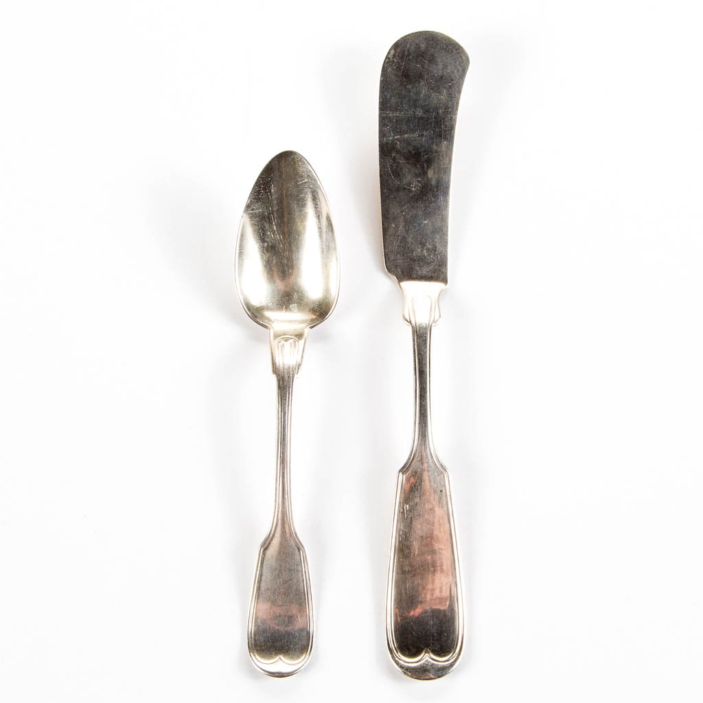 NEW ORLEANS, LOUISIANA RETAILED COIN SILVER FLATWARE: NEW ORLEANS, LOUISIANA RETAILED COIN SILVER FLATWARE ARTICLES, LOT OF TWO, comprising a Wood & Hughes "French Thread" pattern teaspoon and master butter spreader, each forward-tipped fiddle back, mark