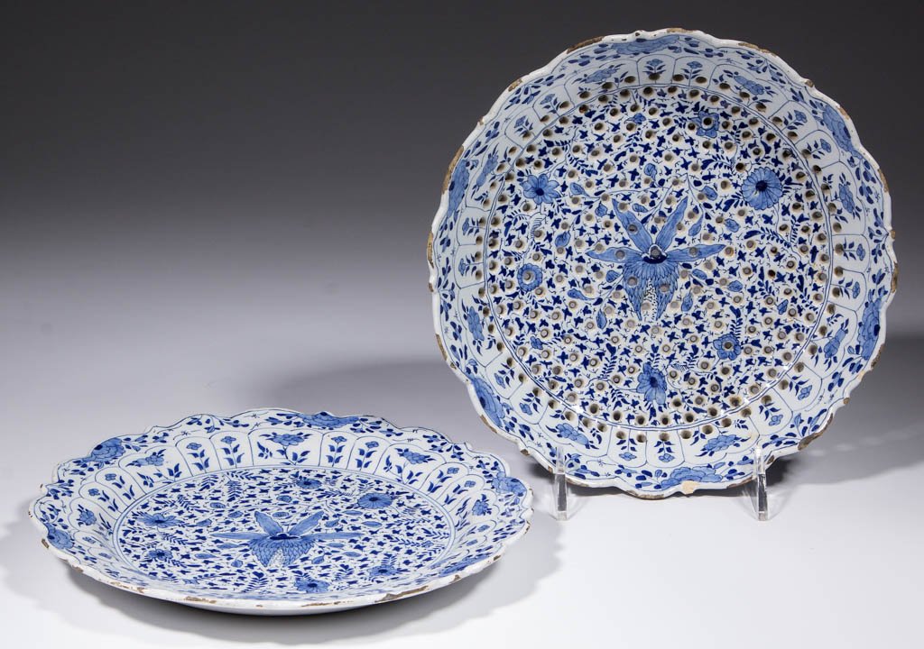 DUTCH DELFT TIN-GLAZED EARTHENWARE COLANDER WITH: DUTCH DELFT TIN-GLAZED EARTHENWARE COLANDER WITH MATCHING UNDERTRAY, having lobed and pointed rim on colander with three raised feet and intricate pierced design on interior, lobed undertray with matc