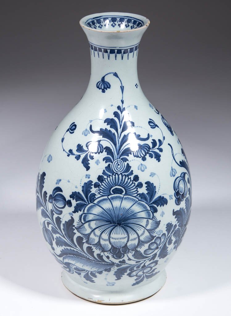 ENGLISH DELFT TIN-GLAZED EARTHENWARE WATER BOTTLE /: ENGLISH DELFT TIN-GLAZED EARTHENWARE WATER BOTTLE / EWER / GUGLET, ovoid, with cut foot rim, slender, tapered neck, and large bold floral designs on sides and small geometric design on interior of rim