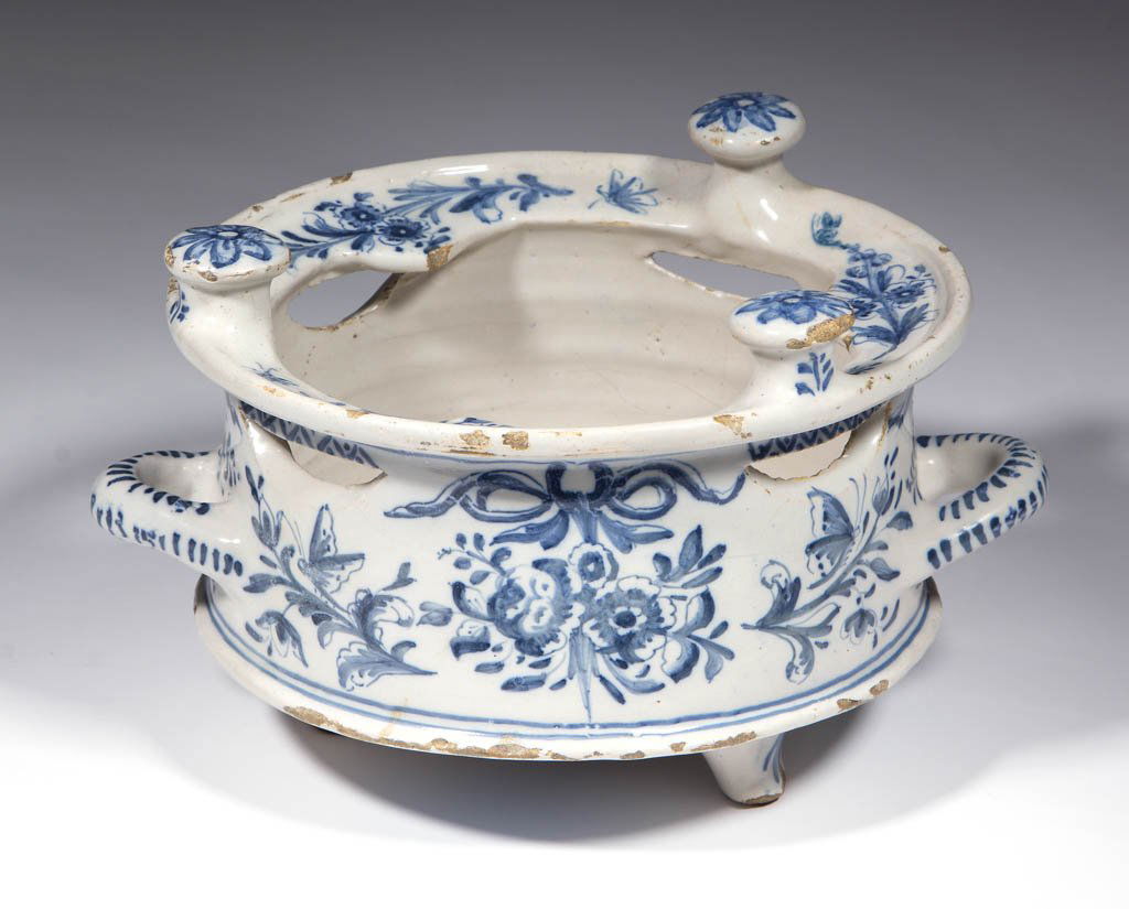 DUTCH DELFT TIN-GLAZED EARTHENWARE PLATE WARMER / FOOD: DUTCH DELFT TIN-GLAZED EARTHENWARE PLATE WARMER / FOOD WARMER, having a deep interior well, four cut-outs below rim, two loop handles opposite one another, three raised knobs on rim, and three raised