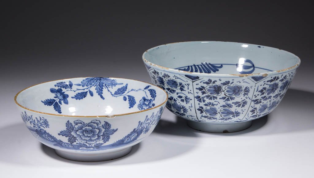 ENGLISH DELFT TIN-GLAZED EARTHENWARE BOWLS, LOT OF TWO: ENGLISH DELFT TIN-GLAZED EARTHENWARE BOWLS, LOT OF TWO, comprising one measuring 10" D and 4 5/8" H, having detailed blue floral design within panels on sides, and blue linear designs on interior; and