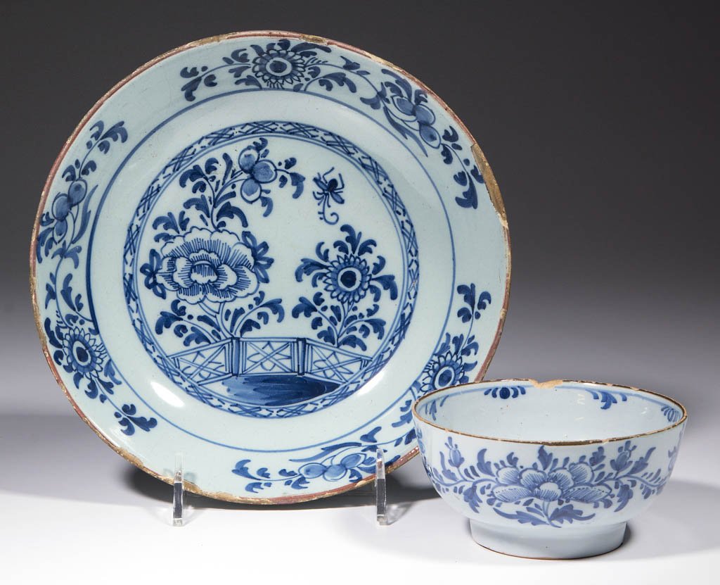 ENGLISH DELFT TIN-GLAZED EARTHENWARE BOWLS, LOT OF TWO: ENGLISH DELFT TIN-GLAZED EARTHENWARE BOWLS, LOT OF TWO, comprising a small example, likely made in Liverpool, having a raised foot, and blue floral decoration on sides and interior, and a larger examp