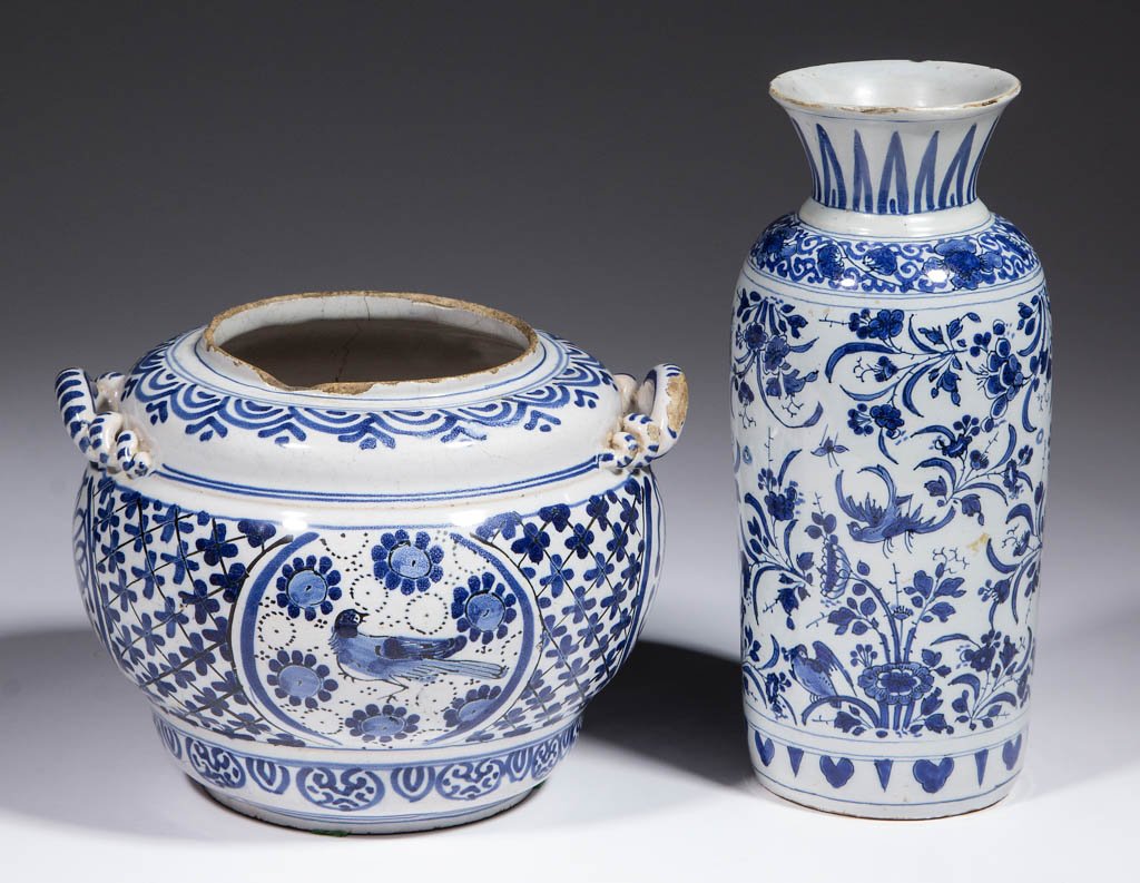 DUTCH DELFT TIN-GLAZED EARTHENWARE ARTICLES, LOT OF TWO: DUTCH DELFT TIN-GLAZED EARTHENWARE ARTICLES, LOT OF TWO, comprising one straight-sided vase with flared rim and one jar having twist handles, both with geometric, floral, and bird decorations in blue.