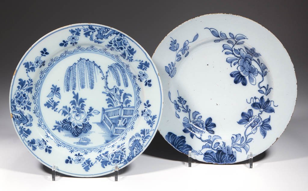 ENGLISH DELFT TIN-GLAZED EARTHENWARE PLATES, LOT OF TWO: ENGLISH DELFT TIN-GLAZED EARTHENWARE PLATES, LOT OF TWO, one probably made in Lambeth, England, having deep blue flowering vines, and one with Chinoiserie floral and will tree design with fence and fl