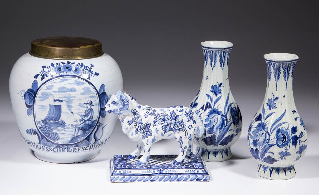 DUTCH DELFT TIN-GLAZED EARTHENWARE ARTICLES, LOT OF: DUTCH DELFT TIN-GLAZED EARTHENWARE ARTICLES, LOT OF FOUR, comprising one pair of molded, fluted vases with floral designs; one molded ram figure on a stand with floral decorations; and one jar with me