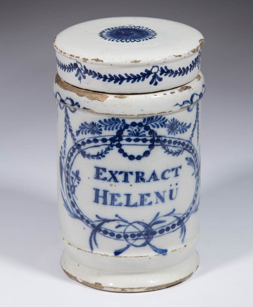 DUTCH DELFT TIN-GLAZED EARTHENWARE DRUG / APOTHECARY: DUTCH DELFT TIN-GLAZED EARTHENWARE DRUG / APOTHECARY JAR, having an elaborate blue bowl, garland, and floral design on one side and cover, with "EXTRACT / HELENU" within a beaded, painted frame. Unmar