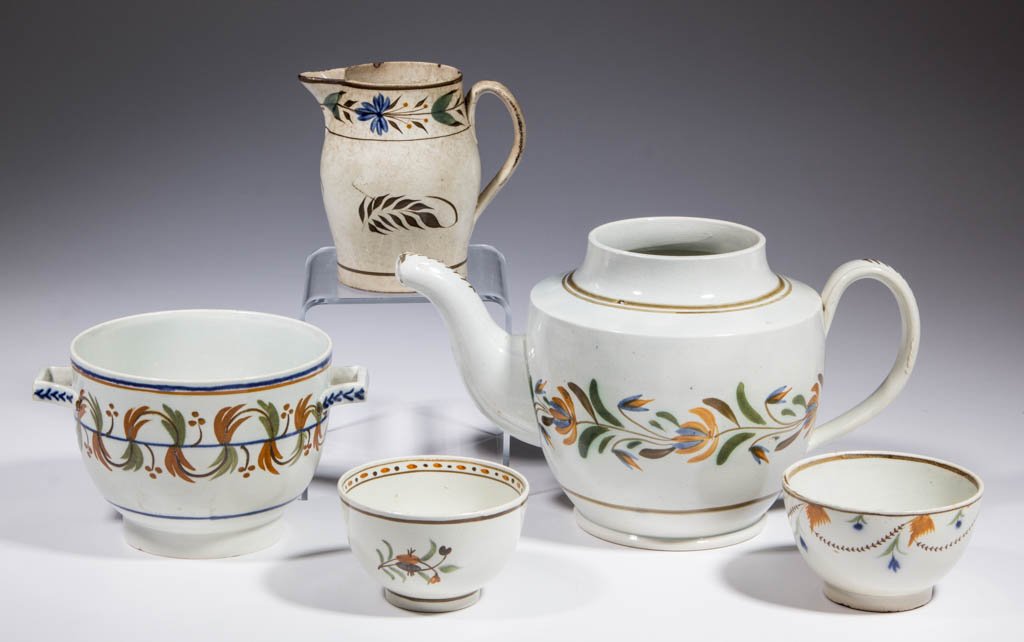 ENGLISH PEARLWARE CERAMIC ARTICLES, LOT OF FIVE: ENGLISH PEARLWARE CERAMIC ARTICLES, LOT OF FIVE, comprising one small cream jug, two teabowls, one teapot and one sugar, both lacking covers; all having polychrome enamel floral and geometric designs.