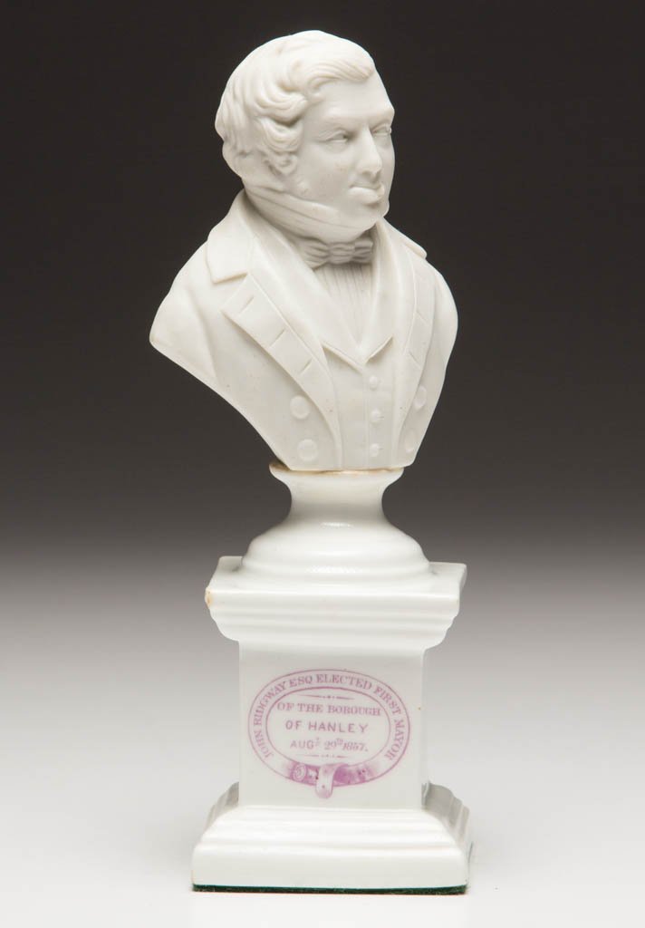 ENGLISH RIDGWAY PARIAN BONE CHINA CERAMIC BUST: ENGLISH RIDGWAY PARIAN BONE CHINA CERAMIC BUST, having in pink transfer on front of small glazed plinth, "JOHN RIDGWAY ESQ ELECTED FIRST MAYOR / OF THE BOROUGH / OF HANLEY / AUGt 29th / 1857." having 