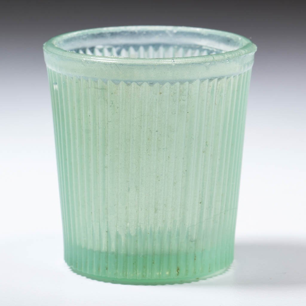 FINE RIB / REEDED (OMN) TOY TUMBLER: FINE RIB / REEDED (OMN) TOY TUMBLER, pale cloudy green. Boston & Sandwich Glass Co., New England Glass Co., and possibly others. Third quarter 19th century. 1 3/4" H, 1 5/8" D rim. Undamaged. Literatu