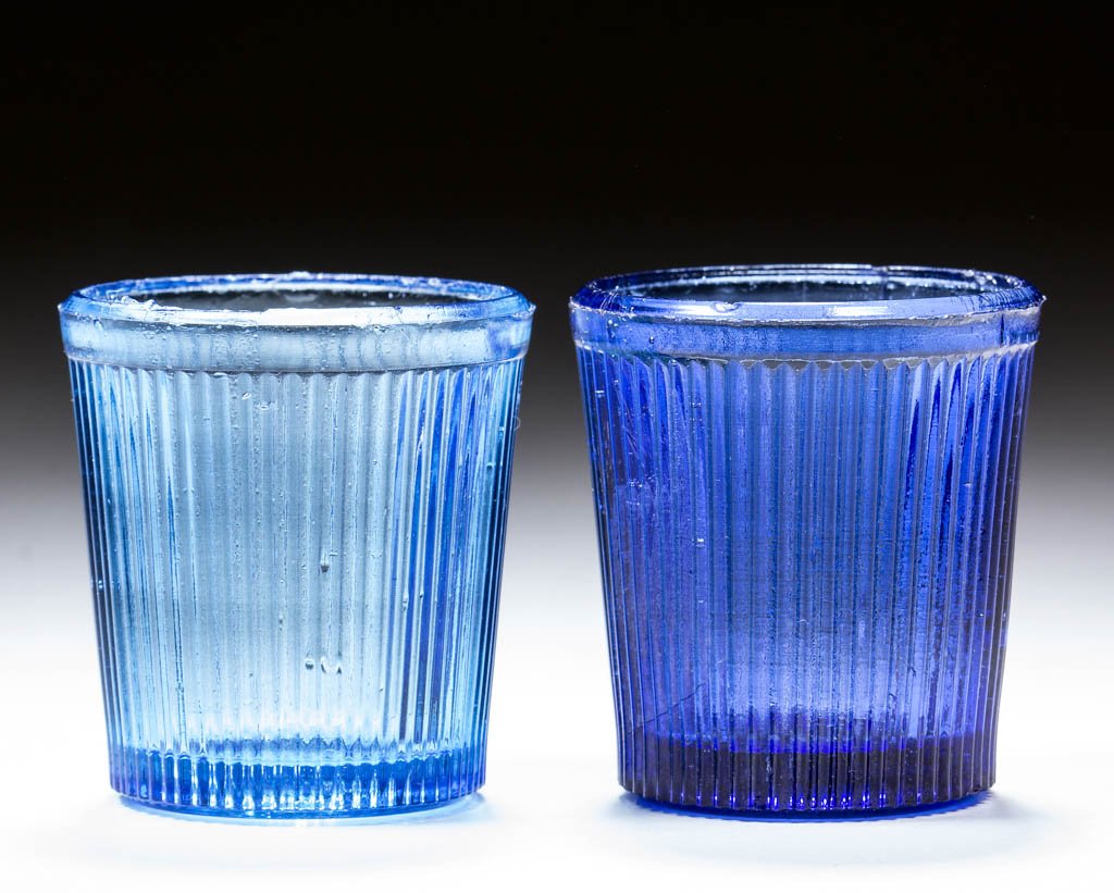 FINE RIB / REEDED (OMN) TOY TUMBLERS, LOT OF TWO: FINE RIB / REEDED (OMN) TOY TUMBLERS, LOT OF TWO, pale blue and medium blue. Boston & Sandwich Glass Co., New England Glass Co., and possibly others. Third quarter 19th century. Both 1 7/8" H, 1 3/4" 