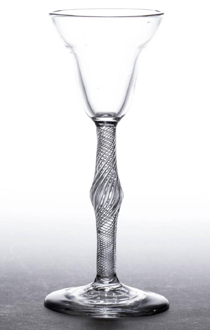 ENGLISH FREE-BLOWN AIR-TWIST WINE GLASS: ENGLISH FREE-BLOWN AIR-TWIST WINE GLASS, colorless lead glass, pan-topped pointed round funnel bowl raised on a center-knopped stem containing a multi-spiral twist, conical foot with rough pontil mark