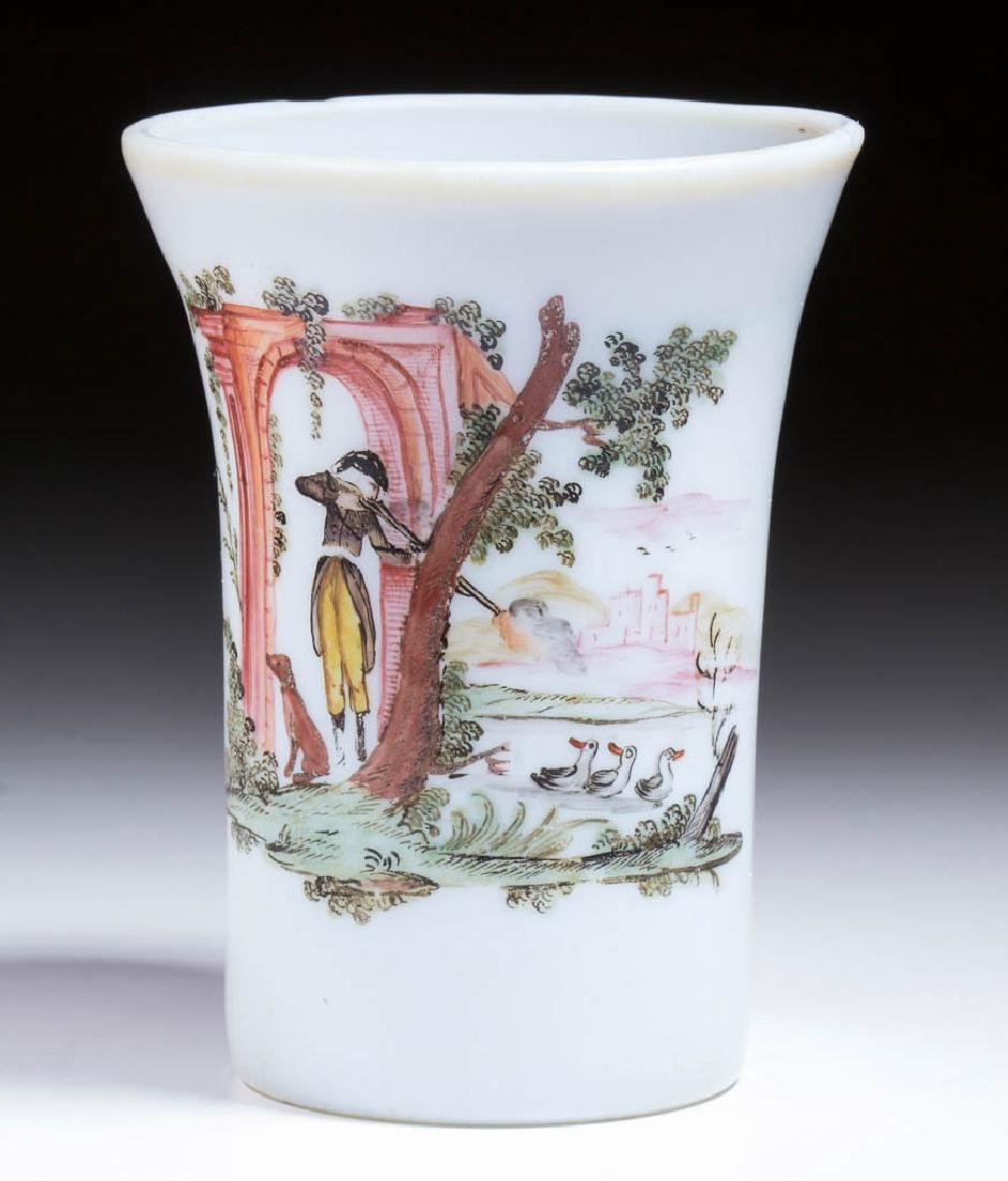 CONTINENTAL ENAMELED BEAKER / TUMBLER: CONTINENTAL ENAMELED BEAKER / TUMBLER, deep fiery opalescent, conical form with flared rim, polychrome decoration depicting a hunter with gun, dog, and ducks on a pond, rough pontil mark. Late 18th/ea
