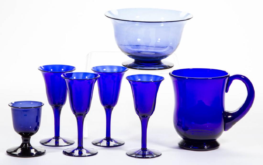 ASSORTED FREE-BLOWN GLASS ARTICLES, LOT OF SEVEN: ASSORTED FREE-BLOWN GLASS ARTICLES, LOT OF SEVEN, cobalt blue, including four wines, a mug signed "THOMAS WEBB", and a footed bowl. Probably England. 19th century. 2 7/8" to 4 1/2" H.Undamaged with a