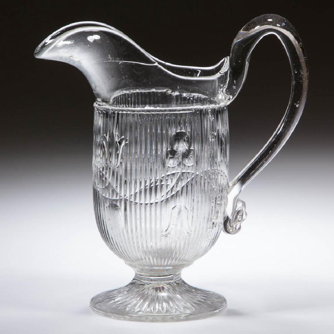 BELLFLOWER - DOUBLE VINE CREAMER: BELLFLOWER - DOUBLE VINE CREAMER, colorless lead glass, vines flowing right, applied handle, foot with 36 rays underneath. Probably M'Kee & Brother(s). Third quarter 19th century. 6 1/2" HOA, 3 1/8" D