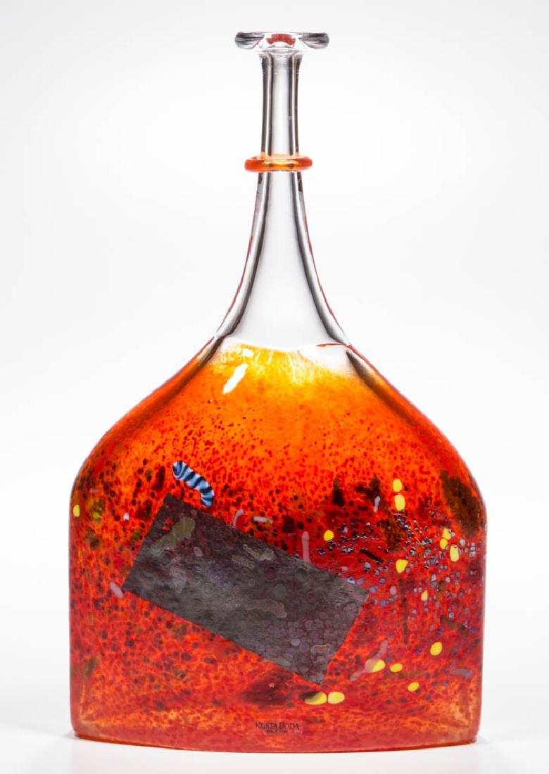 BERTIL VALLIEN / KOSTA BODA STUDIO ART GLASS BOTTLE: BERTIL VALLIEN / KOSTA BODA STUDIO ART GLASS BOTTLE, colorless cased orange, polychrome flecks to the exterior with a rectangular metal inclusion, retains original label, signed and numbered. Sweden.