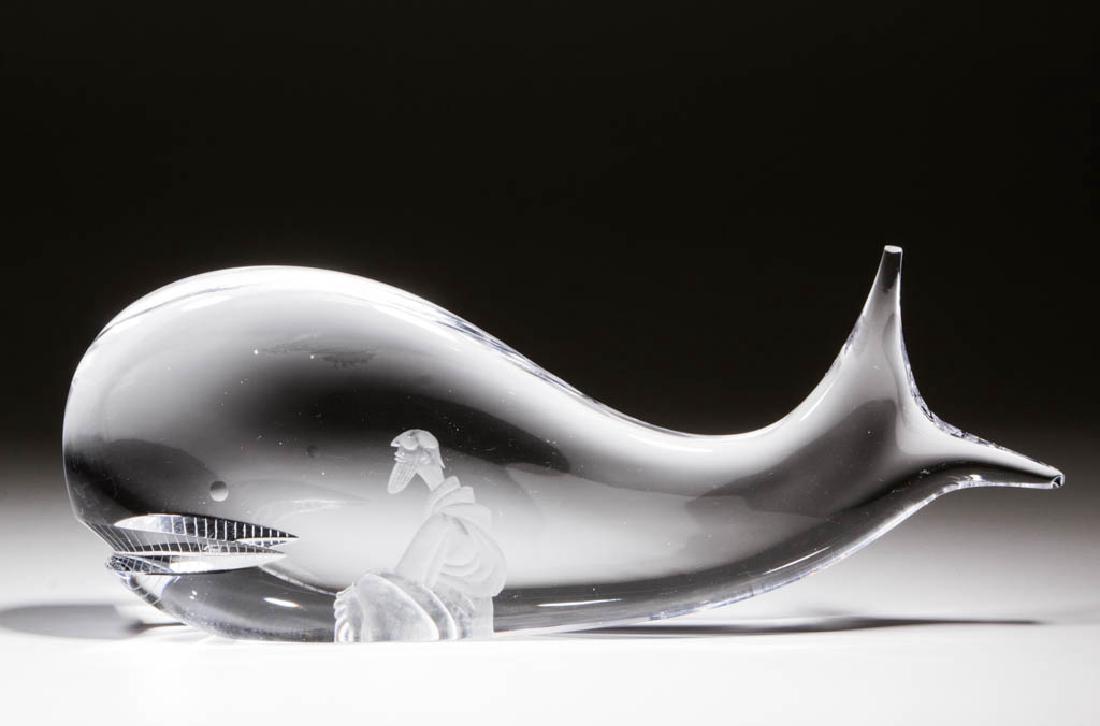 VICKE LINDSTRAND / KOSTA BODA STUDIO ART GLASS: VICKE LINDSTRAND / KOSTA BODA STUDIO ART GLASS SCULPTURE, colorless and frosted, depicting Jonah and the Whale, polished based, signed "KOSTA 99407 LINDSTRAND". Sweden. 20th century. 5 1/4" HOA, 13" L