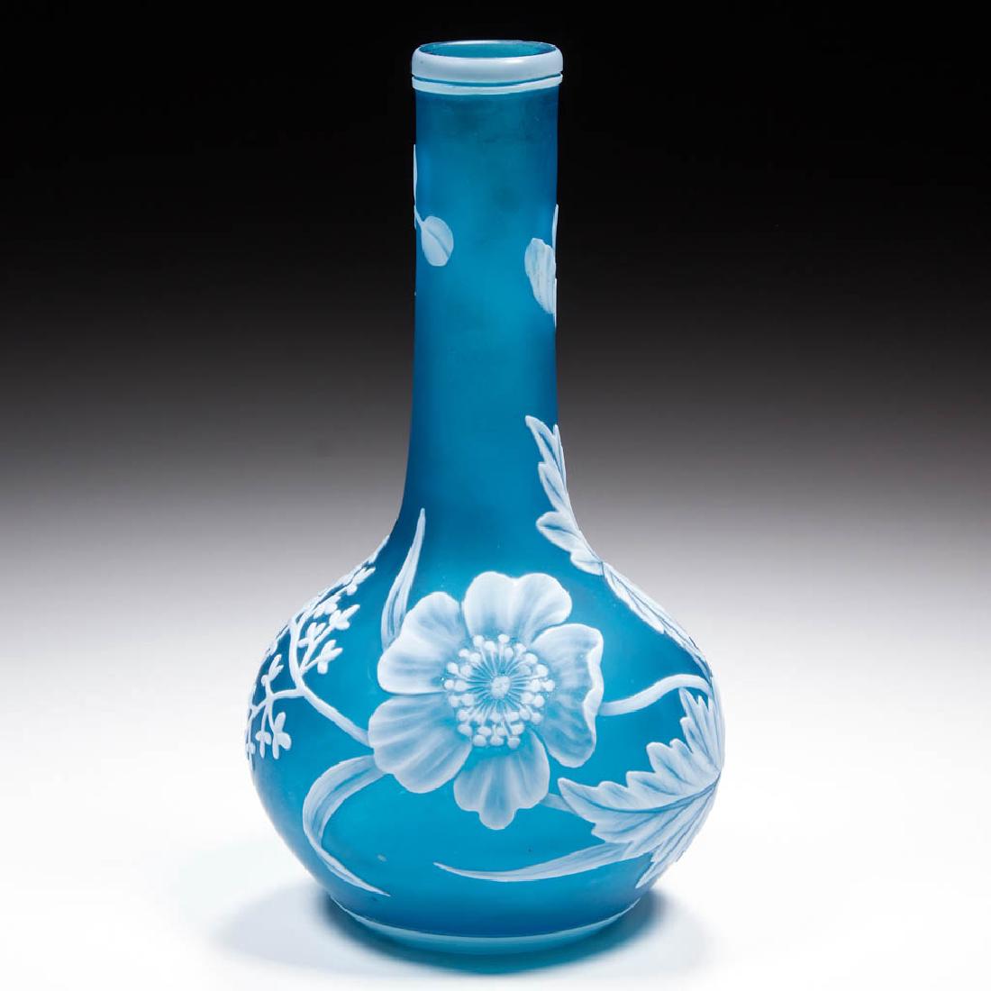 ENGLISH CAMEO ART GLASS VASE: ENGLISH CAMEO ART GLASS VASE, white to teal, bulb form with a floral design, polished pontil mark. Either Thomas Webb & Sons or Stevens & Williams. Fourth quarter 19th century. 5 7/8" H.Undamaged.Prov