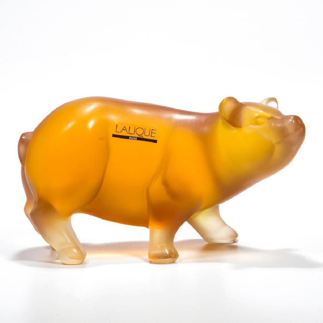 LALIQUE PIG ART GLASS FIGURE: LALIQUE PIG ART GLASS FIGURE, amber, retains original label, signed "LALIQUE FRANCE". Second half 20th century. 3 1/2" H, 6 1/4" WOA. Undamaged. Provenance: Collection of Ellen B. O'Brien, Sarasota, F