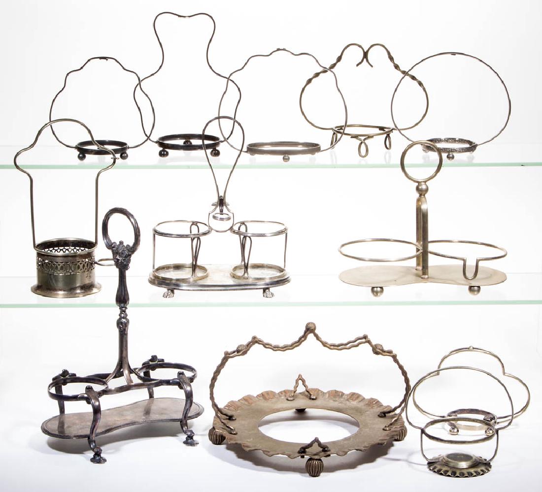 VICTORIAN QUADRUPLE-PLATED AND OTHER STANDS, LOT OF 12: VICTORIAN QUADRUPLE-PLATED AND OTHER STANDS, LOT OF 12, including a marked E. V. Haughwout & Co. example, an Austrian example with Vienna hallmark, tax mark, and dated 1821, and an English example mar
