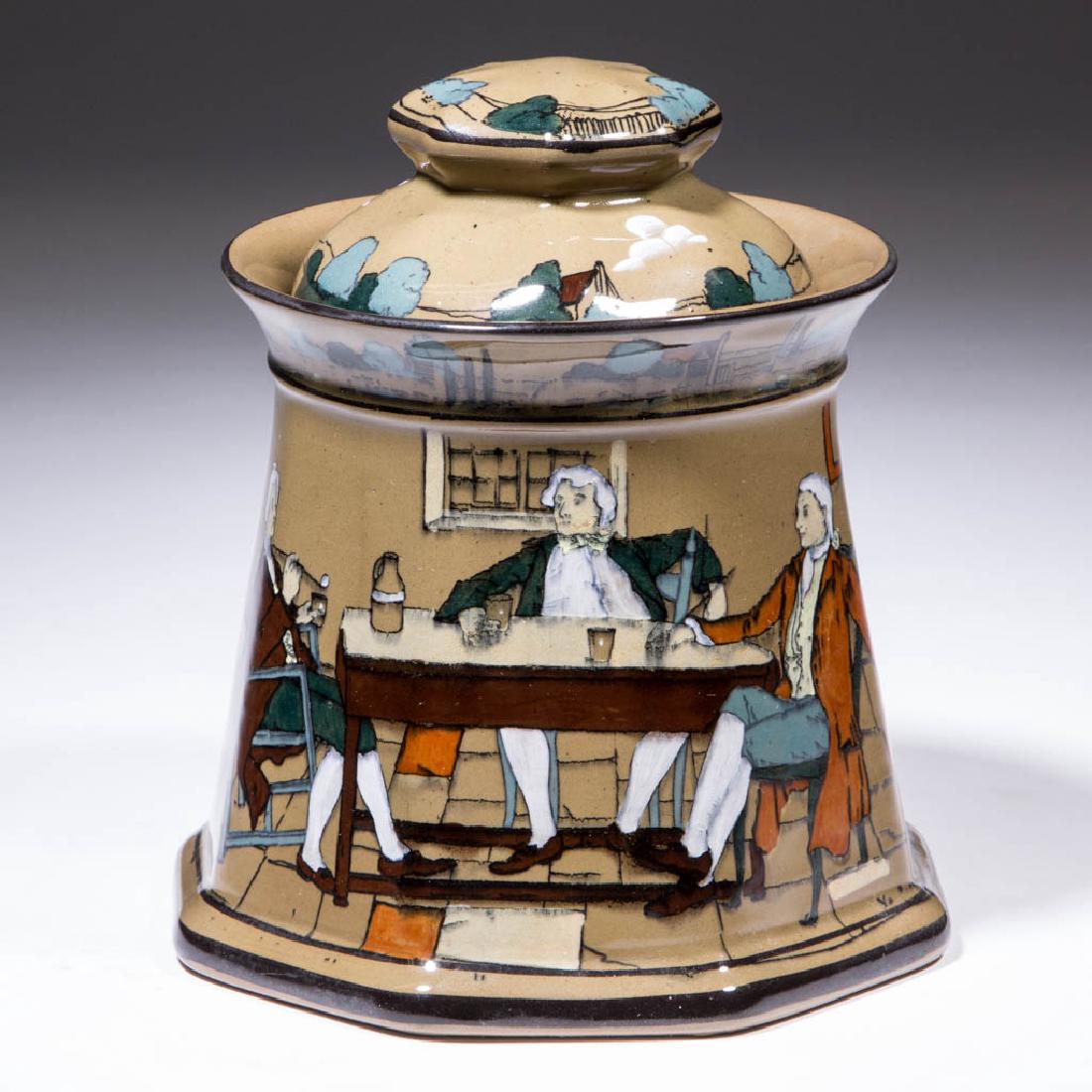 BUFFALO POTTERY DELDARE HUMIDOR: BUFFALO POTTERY DELDARE HUMIDOR, having "YE LION INN" design on sides and cover with intertwining artists' initials. Black printed mark on base with Buffalo over sign reading "MADE AT / ye / BUFFALO /