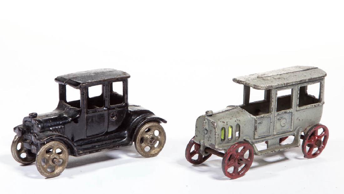 CAST-IRON TOY VEHICLES, LOT OF TWO: CAST-IRON TOY VEHICLES, LOT OF TWO, comprising a Hubley or Arcade Ford Model T coupe and an unmarked limousine/sedan, each in original paint. Circa 1920. 4" LOA (each).Very good overall with minor wea