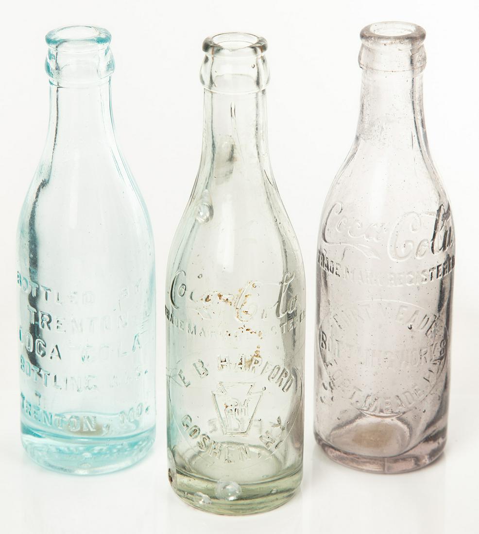 Coca-Cola: Three Straight Sided Glass Bottles, E.B.: Coca-Cola: Three Straight Sided Glass Bottles, E.B. Hartford, NY, Trenton Bottling WKS, MO & Fort Meade, FLA. Coca-Cola collectors enjoy acquiring all aspects of the legendary brand, and certainly col