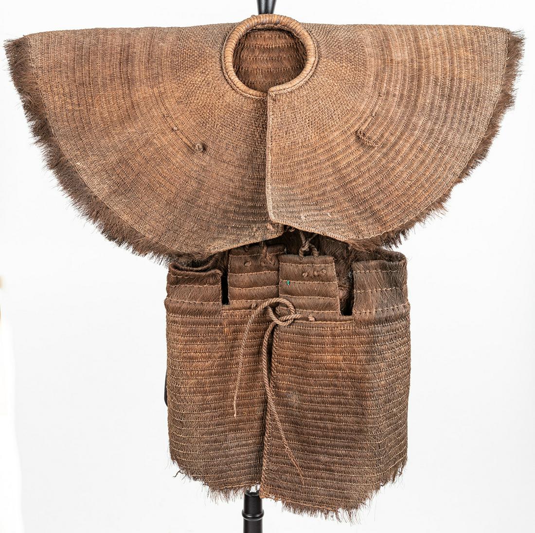 Chinese/Southeast Asian Woven Straw Rain Cape and: Chinese/Southeast Asian Woven Straw Rain Cape and Apron, Early to Middle 20th Century. Chinese and Southeast Asian straw rain capes were used for centuries by the most humble farm worker or fisherman 