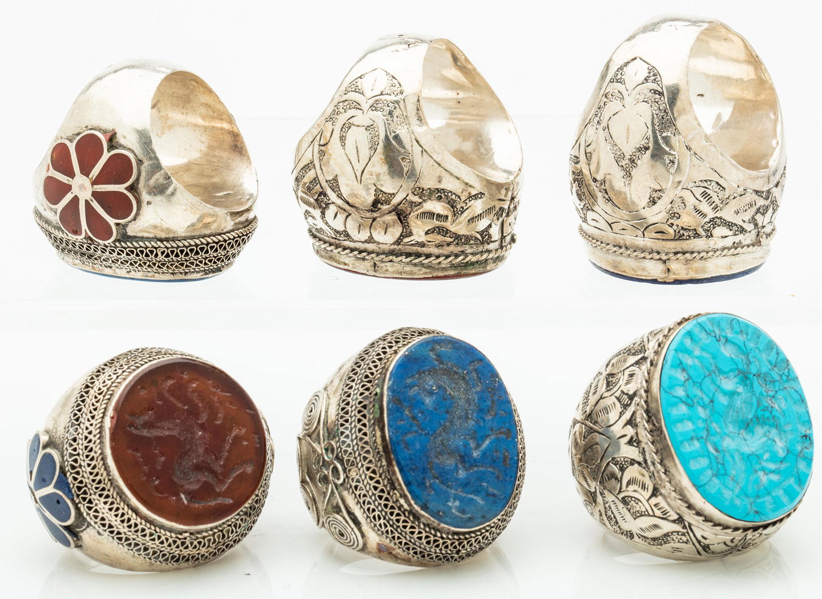 Six (6) Large, Vintage Men's Carved Intaglio Rings: Six (6) Large, Vintage Men's Carved Intaglio Rings Boasting Persian Turquoise, Lapis Luzuli and Carnelian. Six (6) large men's rings of some vintage with carved intaglios of animals. 1.) Persian turqu